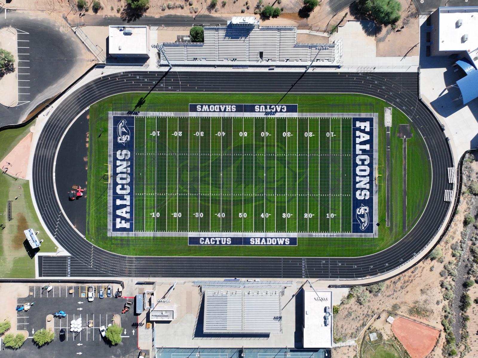 A close-up view of a green American football field in Salt Lake City, showing white yard lines and numbers marking 20, 30, and 40 yards, with clear boundary lines and hash marks on the artificial turf installation.