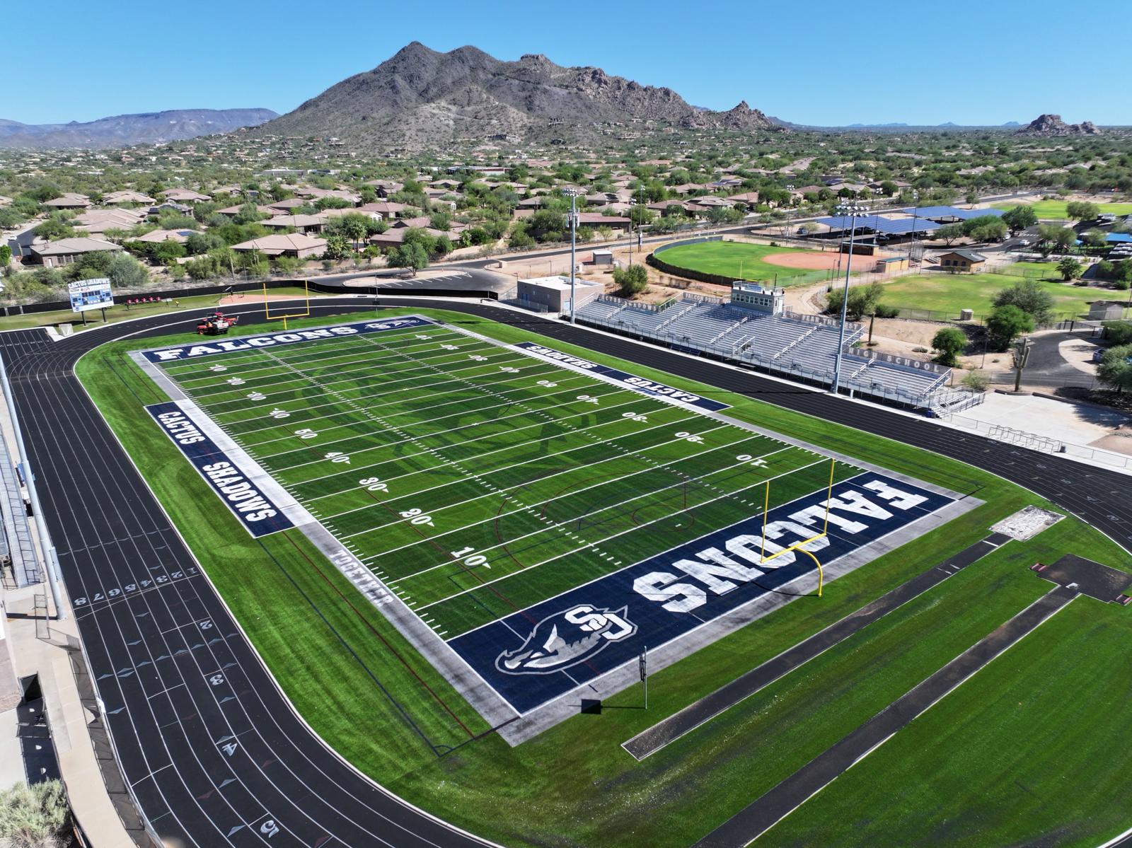 A close-up view of a green American football field in Salt Lake City, showing white yard lines and numbers marking 20, 30, and 40 yards, with clear boundary lines and hash marks on the artificial turf installation.