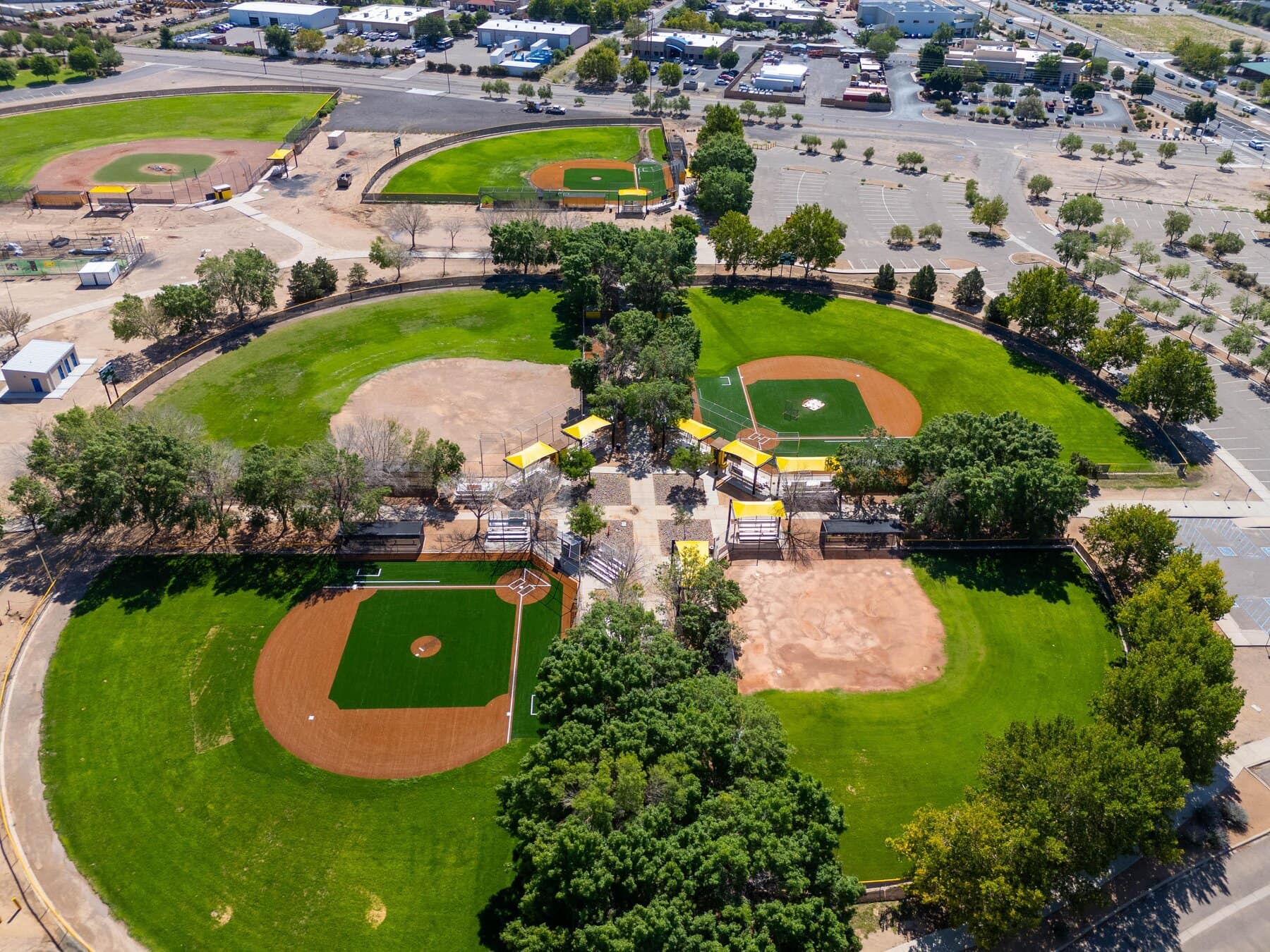 Birds eye view of the Eastdale Little League Complex in Albuquerque, which has the infield, basepaths, and batters box installed with artificial turf by Coyote Sports Turf